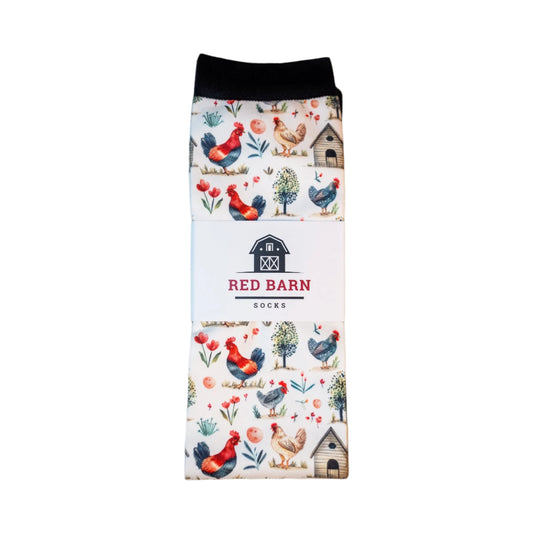 Folded sock with farm animal pattern on a wooden surface
