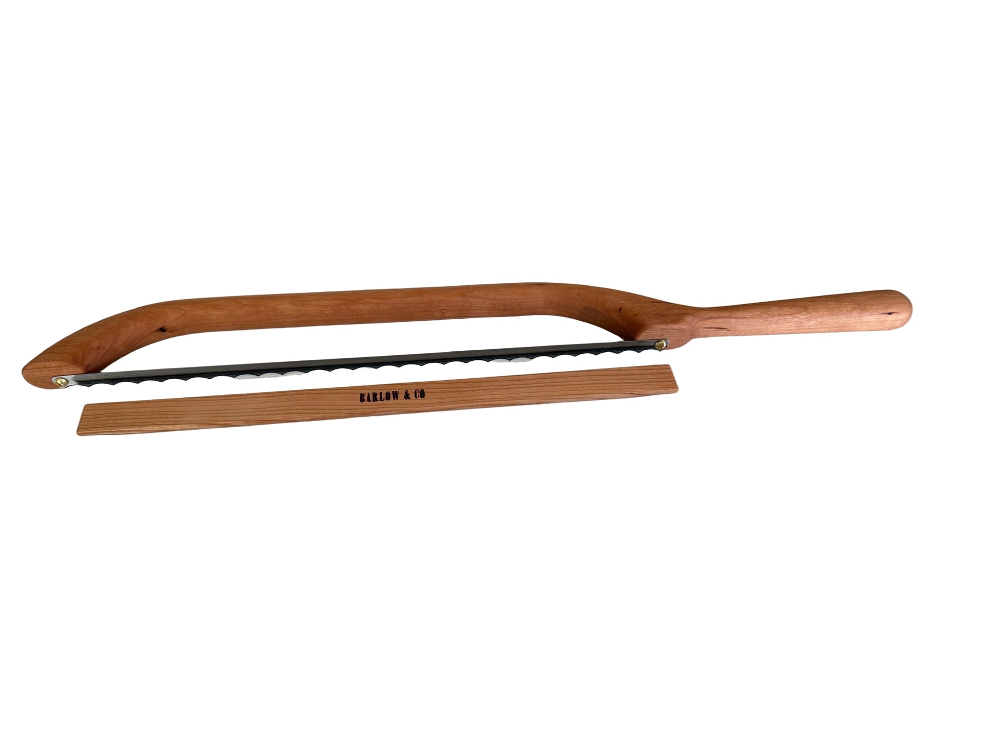 Wooden-handled saw on a white surface